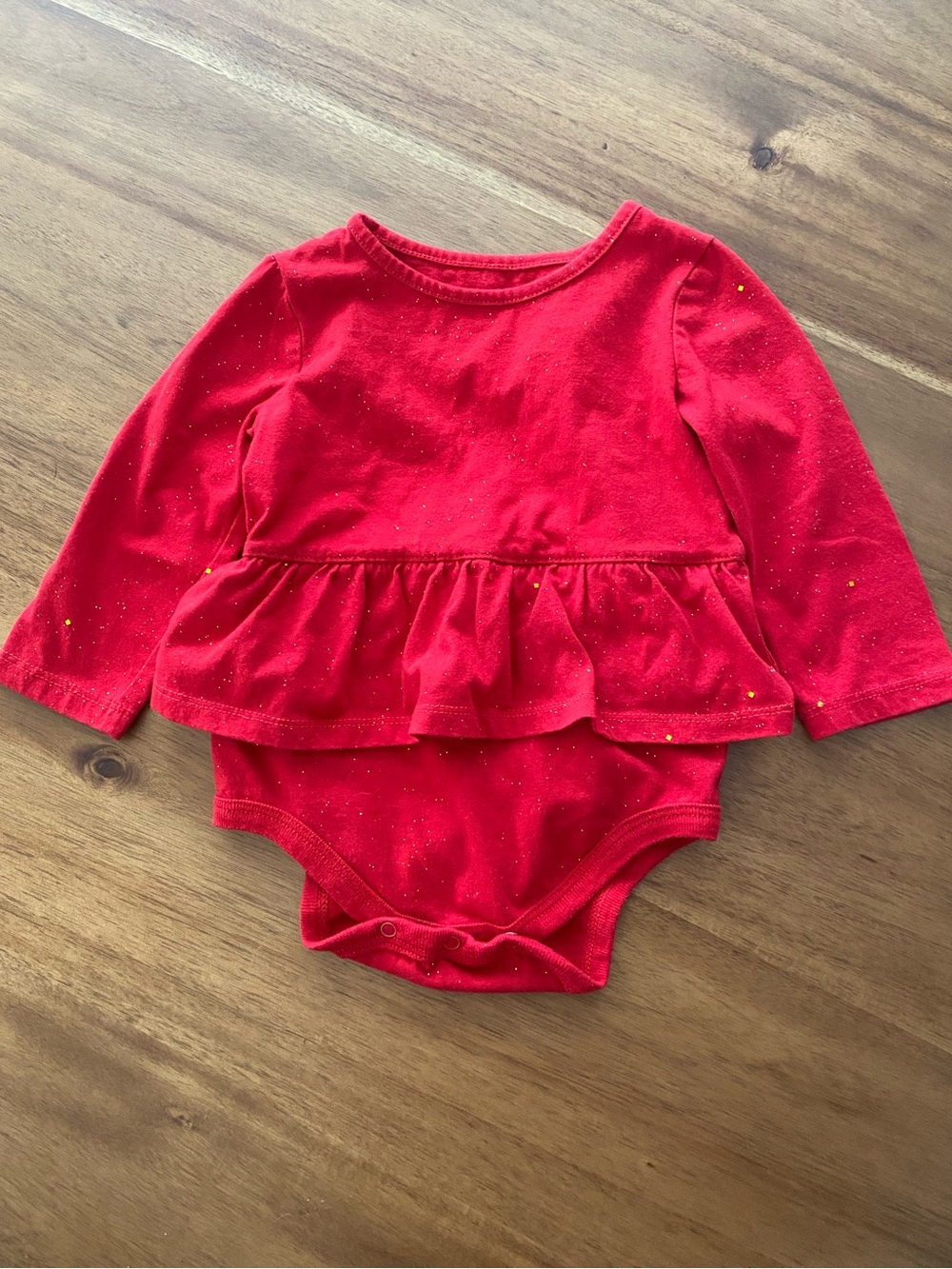 Red sparkly skirted onesie